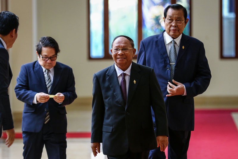 National Assembly President Heng Samrin, center, arrives at the Assembly in Phnom Penh on Wednesday. (Khem Sovannara)