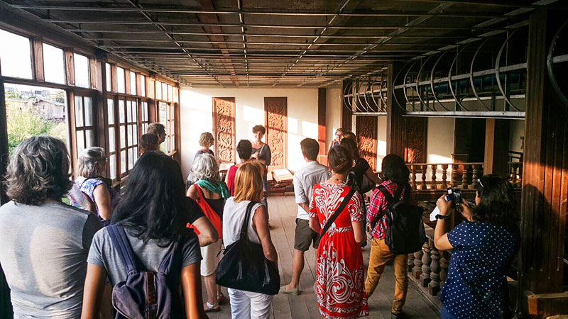 Project co-founder Dana Langlois speaks to visitors inside 'The Boat' in Phnom Penh on Saturday. (Alexis de Suremain)