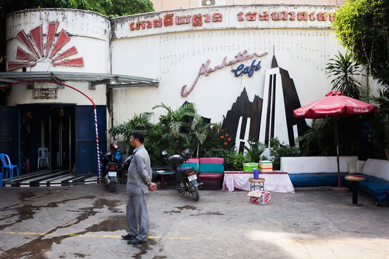 A security guard stands outside the Manhattan Cafe nightclub in Phnom Penh on Monday. (Jens Welding Ollgaard/The Cambodia Daily)