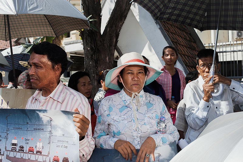 Phnom Penh residents protest outside the Transportation Ministry on Monday, asking for clarification about plans to build an expressway above their homes. (Jens Welding Ollgaard/The Cambodia Daily)