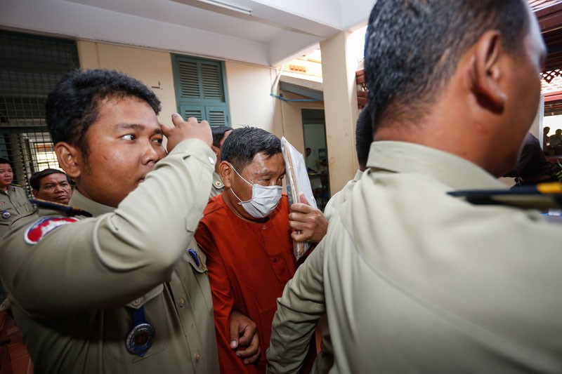 Former Phnom Penh Municipal Court Director Ang Mealaktei arrives at the Kandal Provincial Court on Thursday ahead of his trial on embezzlement charges. (Siv Channa/The Cambodia Daily)