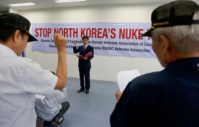 Yang Sung­mo, chairman of the Korean Association of Cambodia, reads out a statement condemning North Korea’s nuclear testing during a protest in Phnom Penh Tower on Friday. (Siv Channa/The Cambodia Daily)