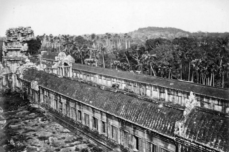 A section of Angkor Wat, with the hill of Phnom Bakheng in the distance, in 1866. (Emile Gsell)