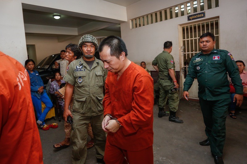 Chen Chun Lin leaves the Phnom Penh Municipal Court on Monday. (Siv Channa/The Cambodia Daily)
