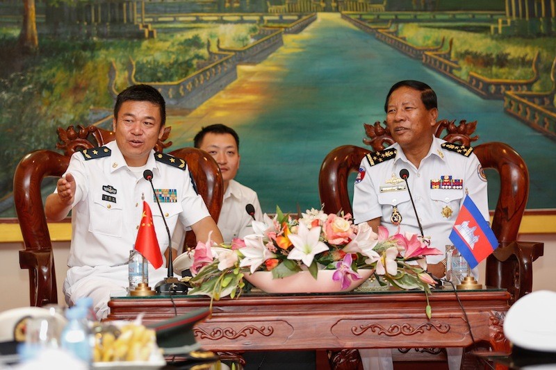 Chinese naval commander Yu Manjiang, left, speaks with Tea Vinh, commander of the Royal Cambodian Navy, during a meeting at the Navy Headquarters in Phnom Penh on Wednesday. (Siv Channa/The Cambodia Daily)