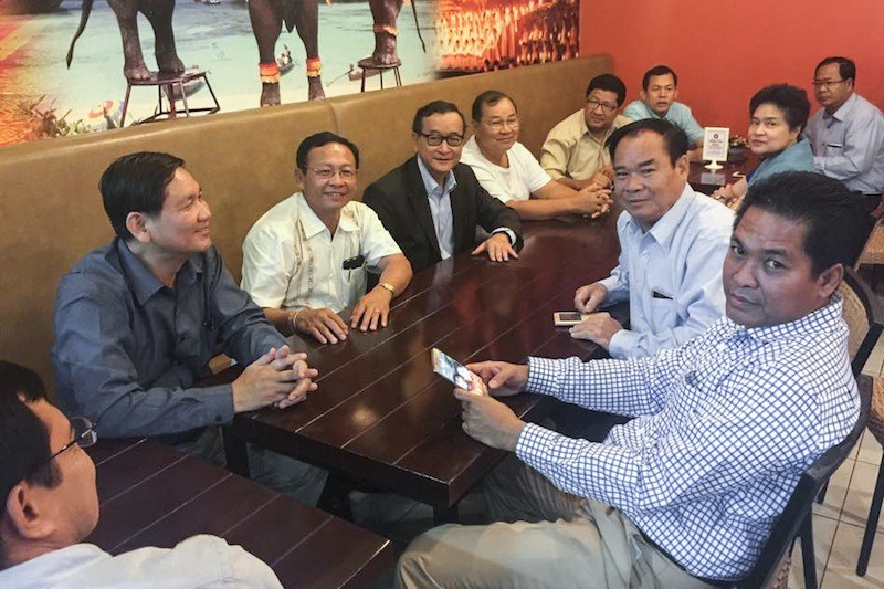 Senior opposition officials meet with exiled CNRP President Sam Rainsy in Manila yesterday, in a photograph posted to the Facebook page of lawmaker Eng Chhay Eang. 