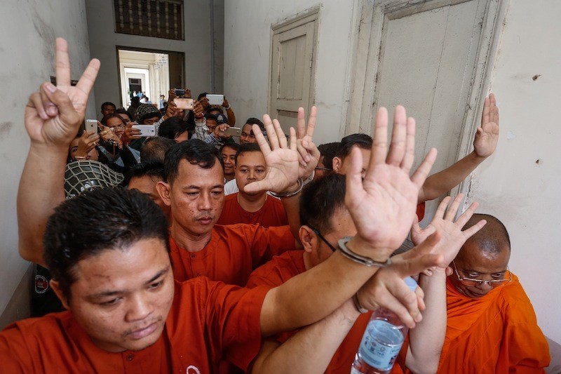 Members of a group of 11 opposition activists who were convicted of insurrection last year leave the Appeal Court in Phnom Penh yesterday. (Siv Channa/The Cambodia Daily)