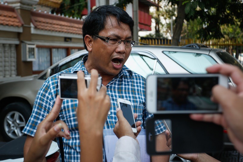 Pheng Vannak speaks to reporters outside the Phnom Penh Municipal Court yesterday after being found guilty of defamation. (Siv Channa/The Cambodia Daily) 