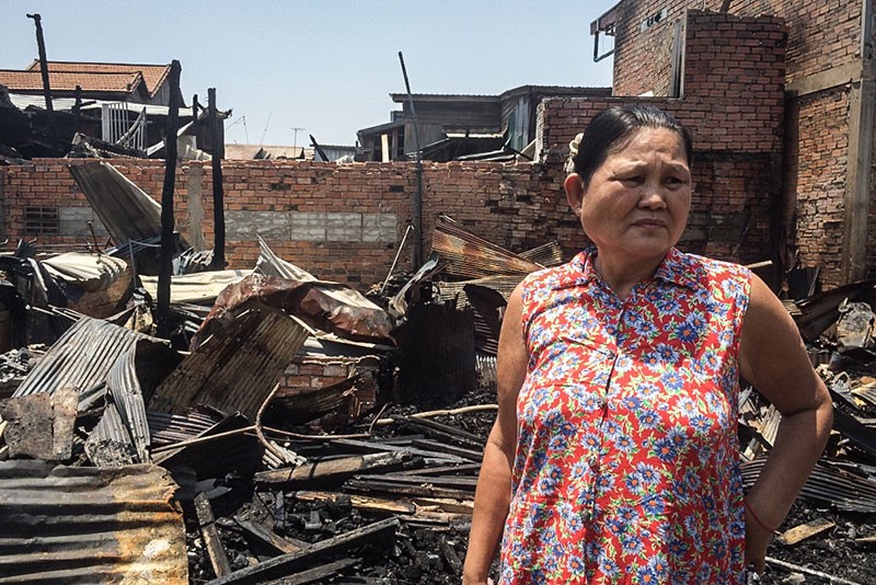 Key Sokha surveys the damage caused by a fire that tore through two villages in Phnom Penh's Chak Angre Loeu commune on Thursday night. (Sonia Kohlbacher/The Cambodia Daily) 