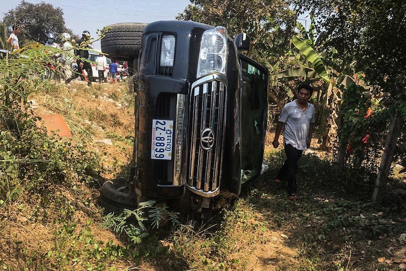 A Toyota SUV belonging to Nuon Someth, an undersecretary of state at the Tourism Ministry, lies on its side after crashing into a motorbike in Kandal province on April 12, killing the motorbike's driver, in a photograph taken by a local reporter.