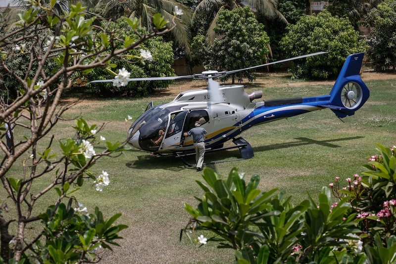A helicopter carrying US Ambassador William Heidt and Environment Minister Say Sam Al lands at the Sofitel hotel in Phnom Penh on Monday after their trip to the Prey Lang forest. (Siv Channa/The Cambodia Daily)