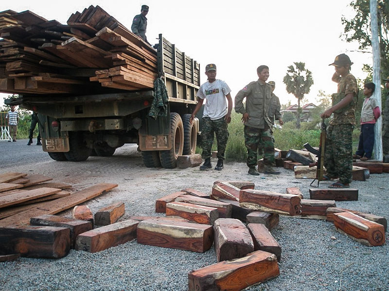 Soldiers surrender a truckload of rosewood they were attempting to smuggle through Siem Reap province in 2011. (Lay Vesna)
