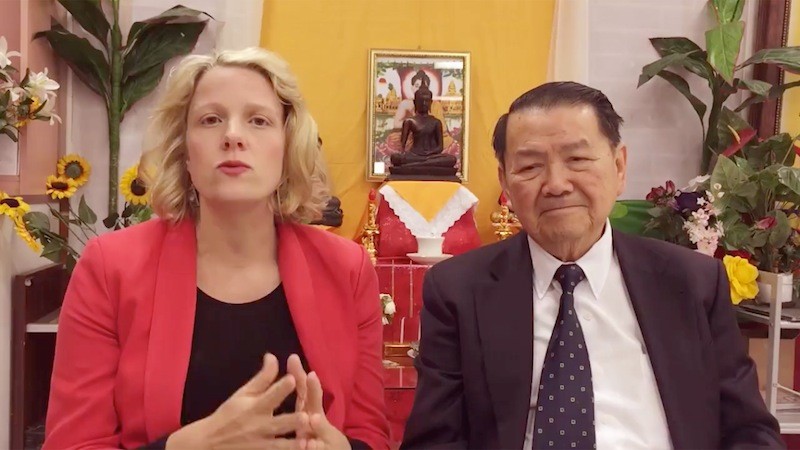 Australian opposition lawmaker Clare O’Neil, left, speaks in Melbourne on Saturday alongside local community leader Youhorn Chea, in a video posted to her campaign’s Facebook page.