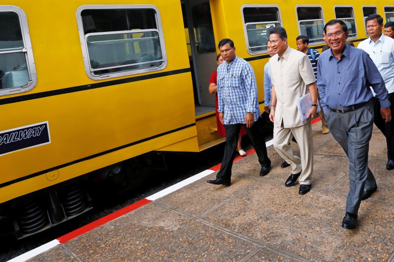 Hun Sen Takes Rail to Sihanoukville; Praises Service 1 Prime Minister Hun Sen arrives at Phnom Penh's train station on Saturday before taking the recently restarted passenger service to Sihanoukville. (Pring Samrang/Reuters)