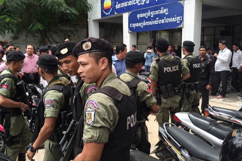 Armed police gather at the CNRP’s Phnom Penh headquarters on Thursday.