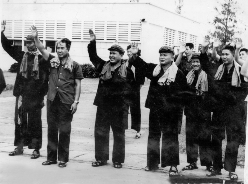 Khmer Rouge leaders including Nuon Chea, third from right, wave at Phnom Penh’s Ponchentong Airport. (DC-CAM)