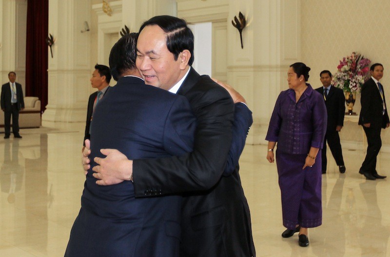 Vietnamese President Tran Dai Quang, right, embraces Prime Minister Hun Sen at the prime minister's office building in Phnom Penh in June. (Pring Samrang/Reuters)