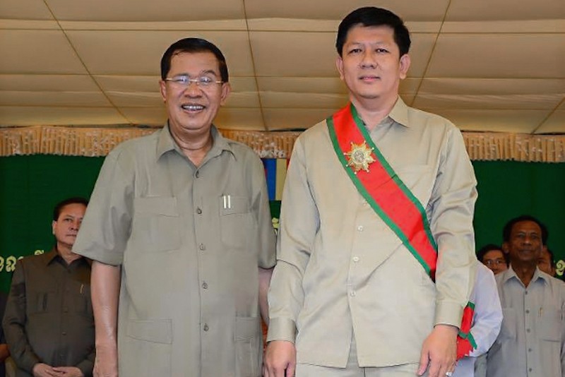 Kry Seang Long receives an award from Prime Minister Hun Sen in photograph posted to the official’s Facebook page in 2013.