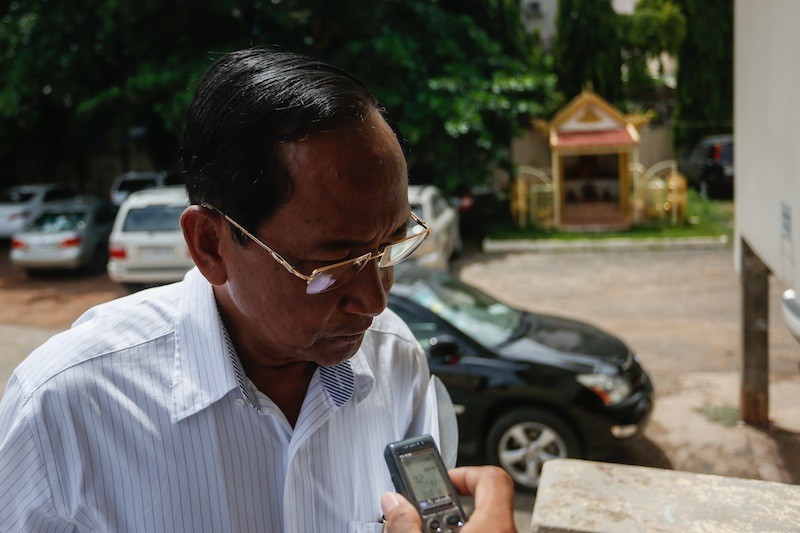 Nuon Someth, an undersecretary of state at the Tourism Ministry, speaks with a reporter outside the Kandal Provincial Court on Wednesday after being questioned about his role in a fatal traffic accident in April. (Siv Channa/The Cambodia Daily)