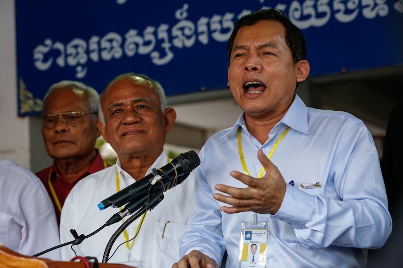 CNRP lawmaker Eng Chhay Eang speaks outside the party's headquarters in June. (Siv Channa/The Cambodia Daily)