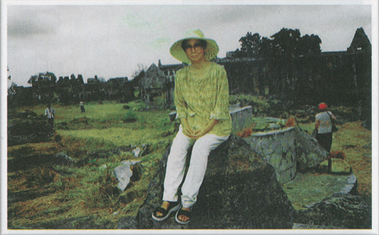 Ms. Vannath sits on a rock at Preah Vihear temple in 1993. (Chea Vannath collection)