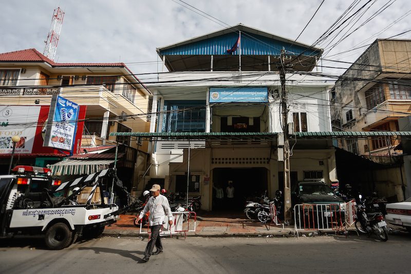 A man walks out of the Daun Penh district police station in Phnom Penh on Tuesday. (Siv Channa/The Cambodia Daily)