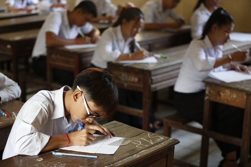 A student takes the national high school completion exam at Sisowath High School in Phnom Penh on Monday morning. (Siv Channa/The Cambodia Daily)