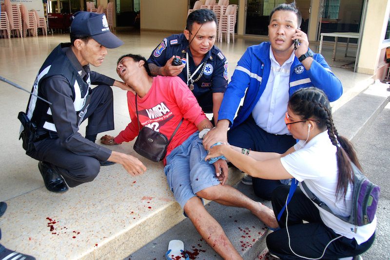 An injured person receives first aid after two bombs exploded in the Thai seaside resort of Hua Hin on Friday. (Reuters)