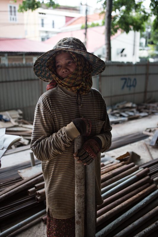 Seoun Pheap stands inside a construction site on the corner of streets 262 and 51. (Hannah Hawkins/The Cambodia Daily)