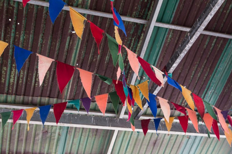 Flags hang from the ceiling of a gazebo at the pagoda. (Hannah Hawkins/The Cambodia Daily)