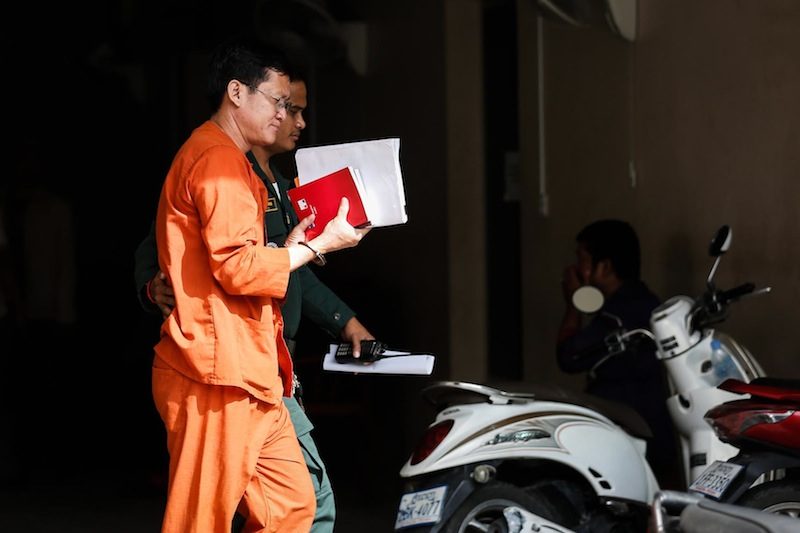 Ny Chakrya enters the Phnom Penh Municipal Court on Thursday morning. (Siv Channa/The Cambodia Daily)