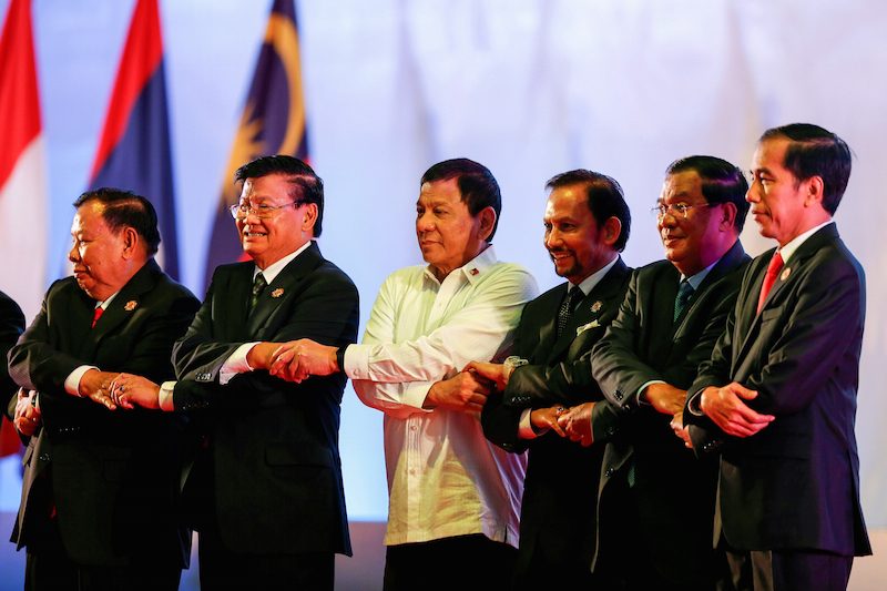 Prime Minister Hun Sen, second from right, poses with other regional leaders at the Asean Summit in Vientiane on Tuesday. (Reuters)