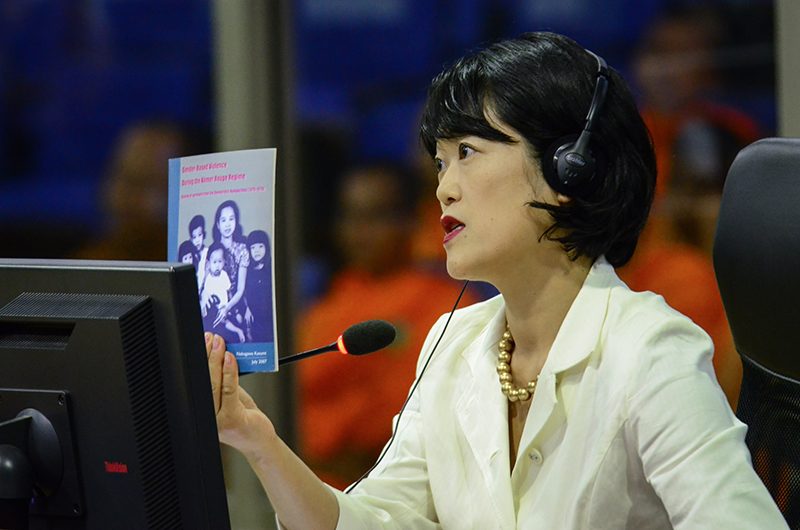 Japanese academic Kasumi Nakagawa holds up one of her books at the Khmer Rouge tribunal in Phnom Penh on Tuesday. (ECCC)