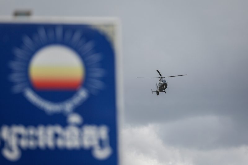 A military helicopter flies over the CNRP's headquarters in Phnom Penh on Wednesday. (Siv Channa/The Cambodia Daily)