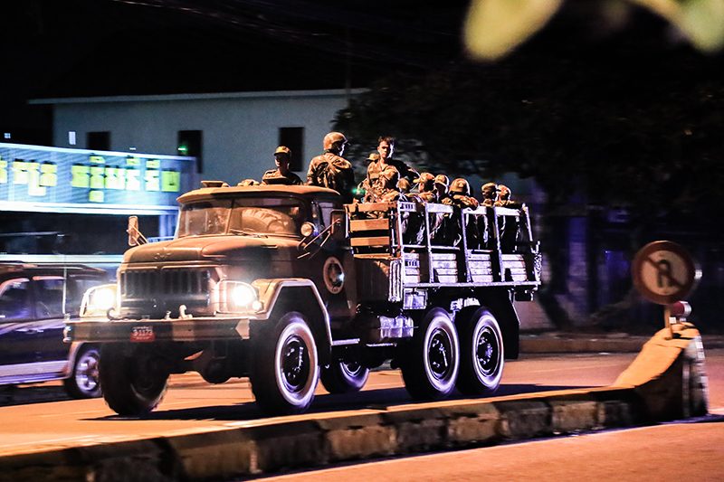 A military truck full of soldiers drives along National Road 2 near the CNRP's headquarters in Phnom Penh on Monday night. (Ma Chettra)