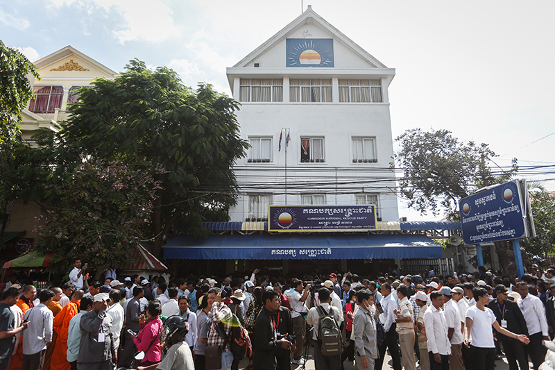 CNRP supporters gather outside the party’s Phnom Penh headquarters on Friday. (Siv Channa/The Cambodia Daily)