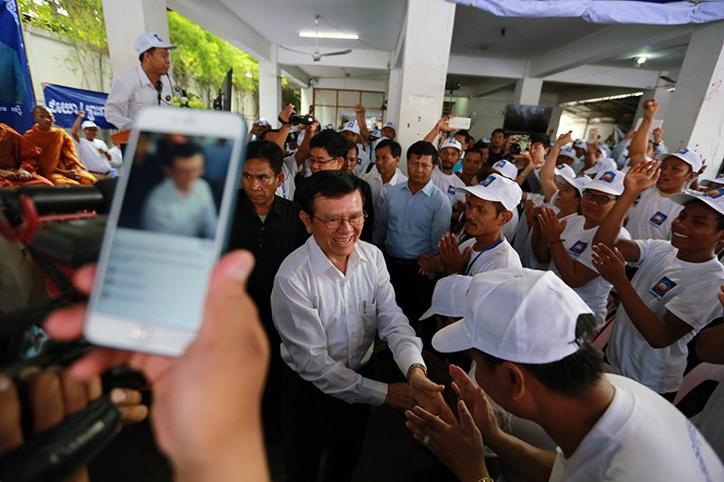 Kem Sokha mingles with supporters at the CNRP’s headquarters in Phnom Penh on Saturday. (Ma Chetra)