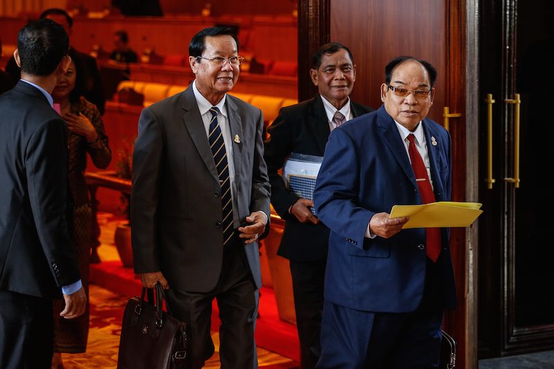 CPP lawmakers leave the Senate chamber on Thursday after stripping the legal immunity of opposition Senator Thak Lany. (Siv Channa/The Cambodia Daily) 