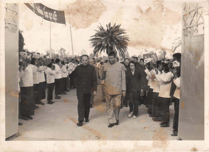 Pol Pot, right, walks alongside Wang Dongxing, former vice chairman of the Communist Party of China, at the Phnom Penh International Airport in November 1978. (DC-CAM)