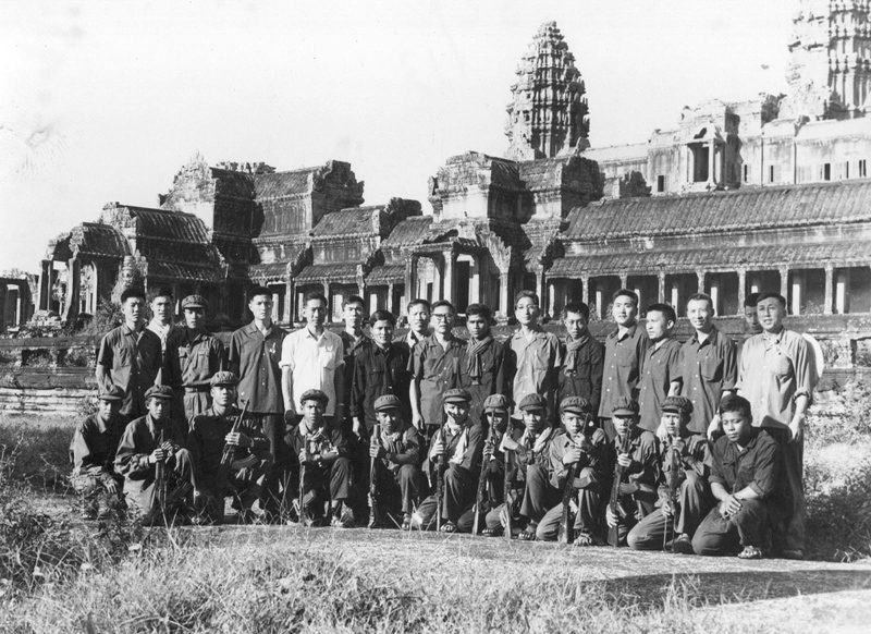 Khmer Rouge cadre and Chinese advisers pose for a photo outside Angkor Wat. (DC-CAM)