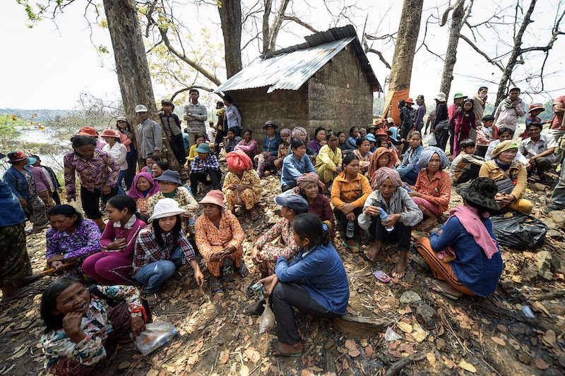 Villagers in Stung Treng province gather in March last year ahead of a ceremony to curse the officials and businessmen behind the Lower Sesan 2 dam. (Matt Walker/The Cambodia Daily)