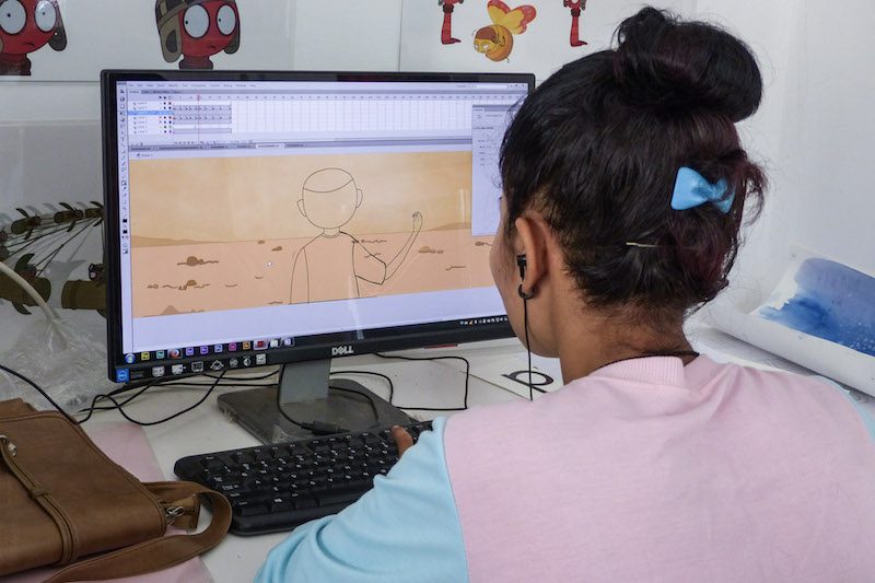 Son Sreyneang works on her animated short film “Water & Forest” at the Visual and Applied Art School in Battambong City in April. (Coralie Baudet)