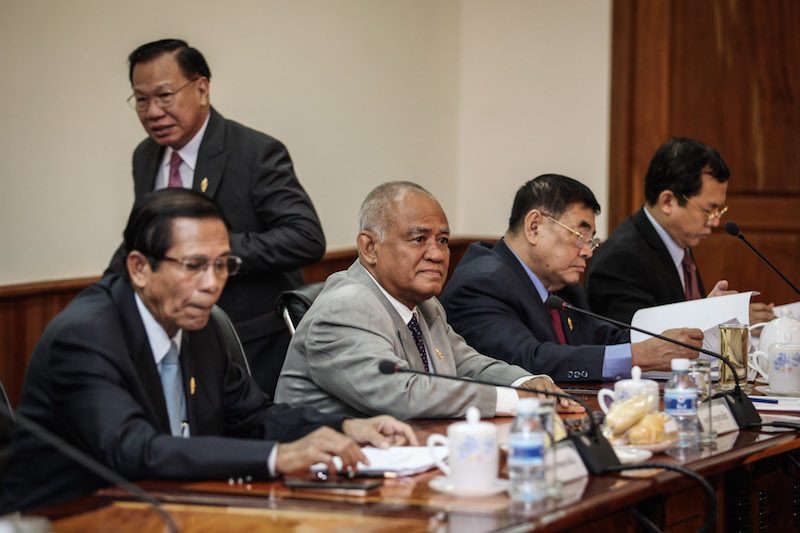 Senior CNRP lawmaker Pol Ham, center, attends a National Assembly permanent committee meeting in Phnom Penh on Tuesday morning. (Khem Sovannara)