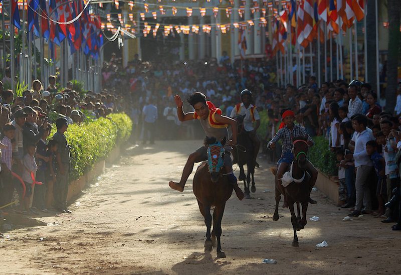 A rider urges his horse forward while preparing for annual races at Wat Vihear Sour in Kandal province on Saturday. (Pring Samrang/Reuters) 