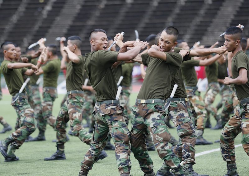 Soldiers rehearse their routine on Wednesday for the opening ceremony of the National Games on Friday at the Olympic Stadium in Phnom Penh. (Siv Channa/The Cambodia Daily)