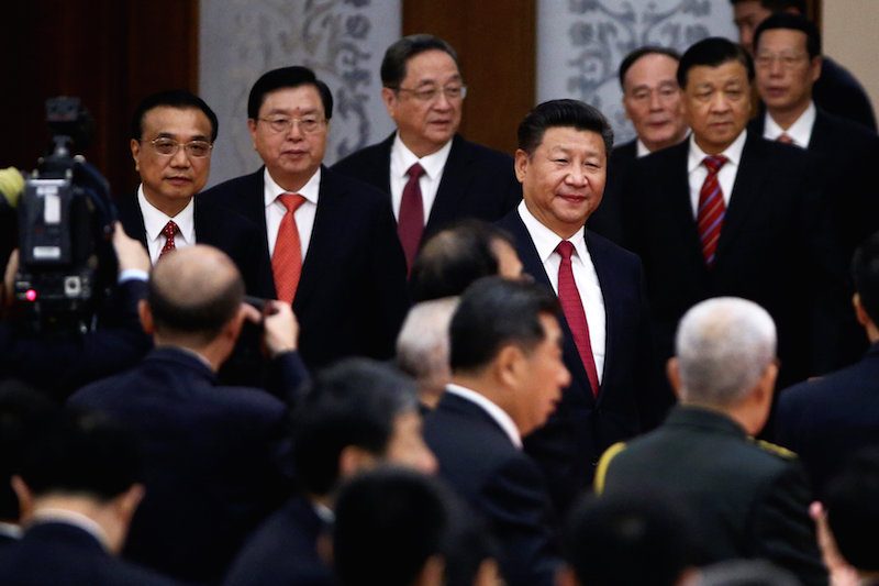 Chinese President Xi Jinping, center, arrives at a reception celebrating of China’s National Day in Beijing on Friday. (Reuters)