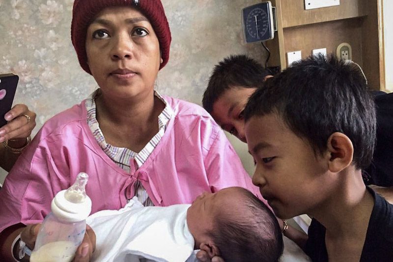 Bou Rachana holds her newborn son, Kem Ley Virak, in a photograph posted to the Facebook page of CNRP official Sang Sann. 
