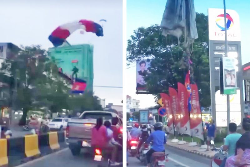 A paratrooper, left, veers off course near the Olympic Stadium on Wednesday, while another hangs from a lamppost on Sihanouk Boulevard, in still images from videos posted to Facebook. 