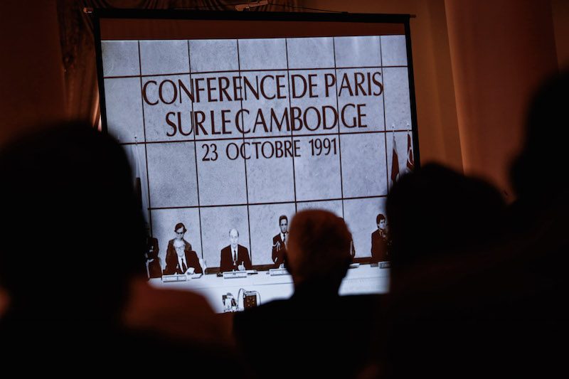 Attendees watch a presentation at an event in Phnom Penh on Thursday commemorating the 25th anniversary of the signing of the 1991 Paris Peace Agreement. (Siv Channa/The Cambodia Daily)