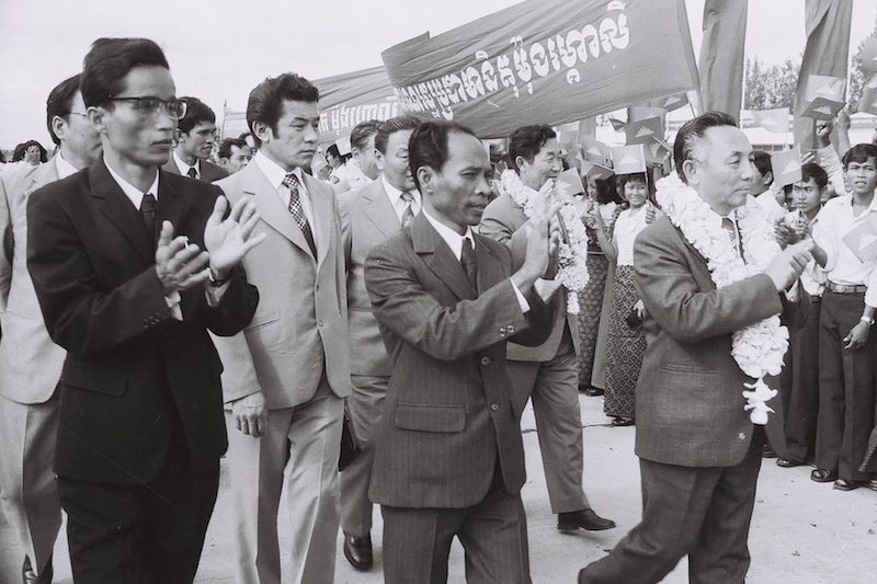Pen Sovann, left, greets a state media delegation from Mongolia in March 1979 along with officials including Heng Samrin, center. (Agence Kampuchea Press)